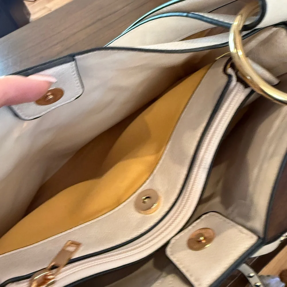 I Light colored faux leather hobo bag with gold-tone hardware like new condition